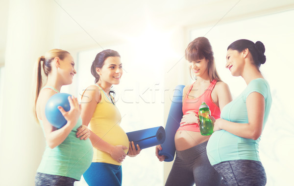 group of happy pregnant women talking in gym Stock photo © dolgachov