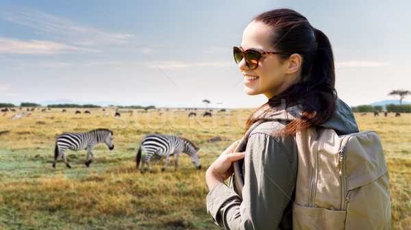 happy woman with backpack traveling in africa Stock photo © dolgachov