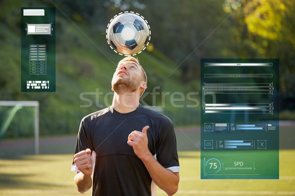 soccer player playing with ball on field Stock photo © dolgachov