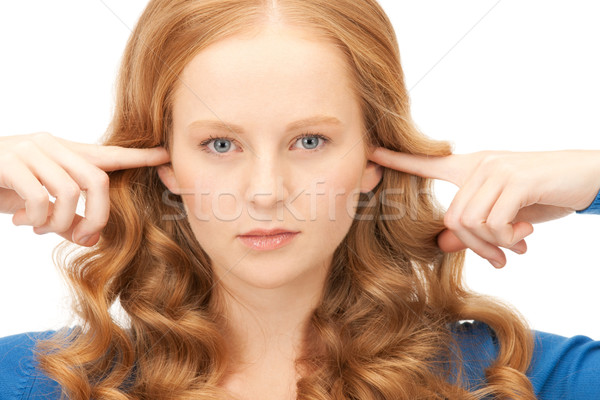 woman with fingers in ears Stock photo © dolgachov