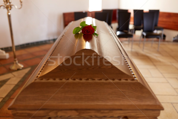 red rose flower on wooden coffin in church Stock photo © dolgachov