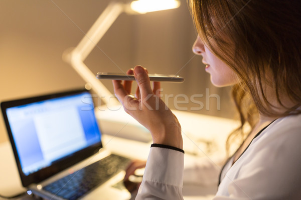businesswoman using voice recorder on smartphone Stock photo © dolgachov