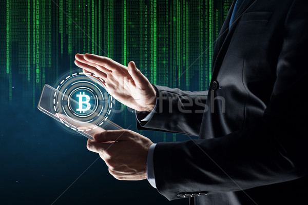 üzletember táblagép bitcoin hologram üzlet jövő Stock fotó © dolgachov