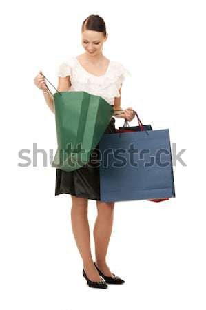 Vásárlás szőke fekete ruha elegáns bevásárlótáskák fehér Stock fotó © dolgachov