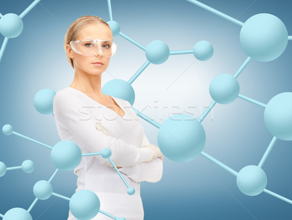 woman in protective glasses and gloves Stock photo © dolgachov