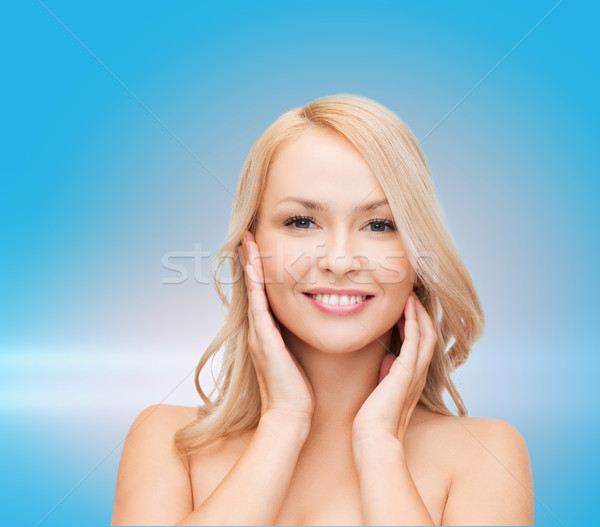woman touching her face skin Stock photo © dolgachov