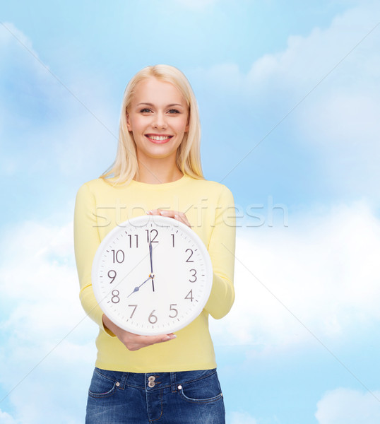 student with wall clock Stock photo © dolgachov