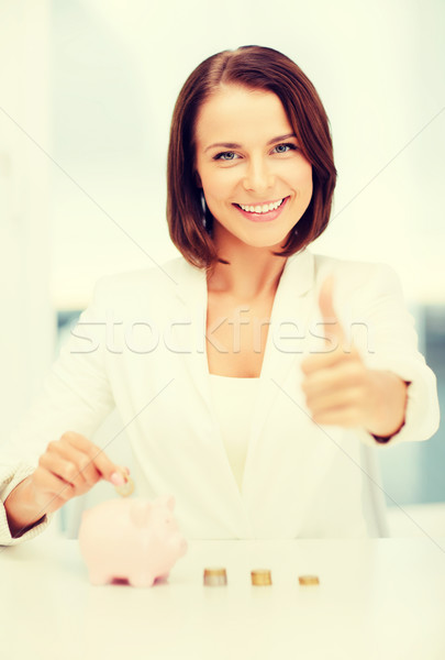 woman with piggy bank and cash money Stock photo © dolgachov