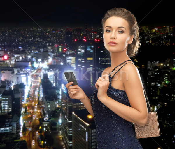 woman in evening dress with vip card Stock photo © dolgachov
