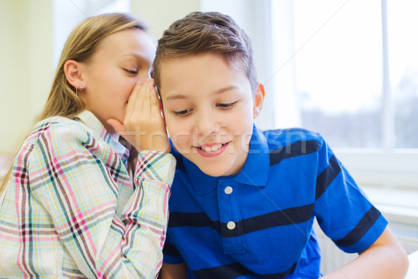 Souriant écolière chuchotement compagne oreille éducation [[stock_photo]] © dolgachov