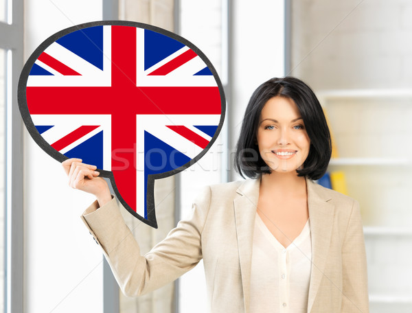 smiling woman with text bubble of british flag Stock photo © dolgachov
