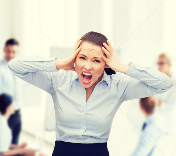 angry screaming businesswoman Stock photo © dolgachov