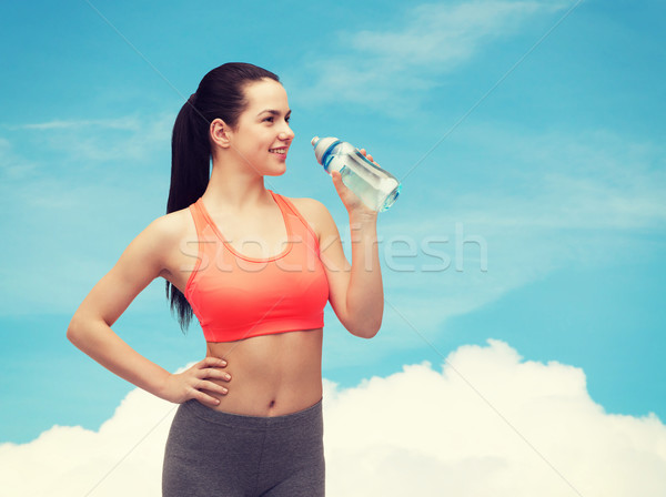 sporty woman with water bottle Stock photo © dolgachov