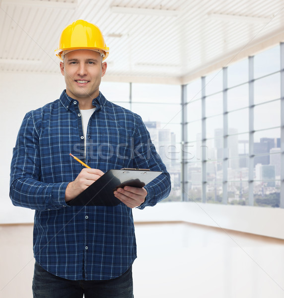 Mosolyog férfi építész sisak vágólap javítás Stock fotó © dolgachov