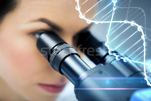 close up of scientist looking to microscope in lab Stock photo © dolgachov