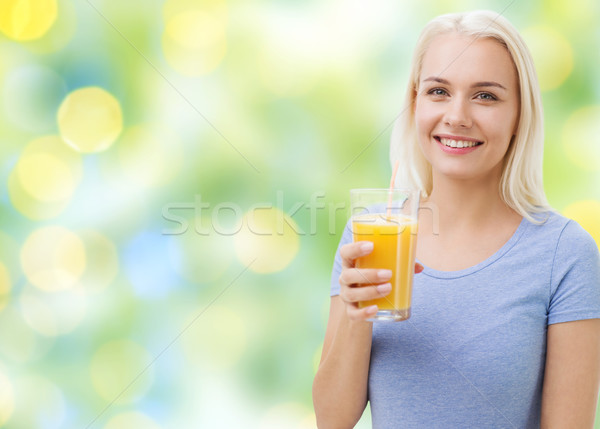 微笑的女人 飲用水 橙汁 健康飲食 素食 節食 商業照片 © dolgachov