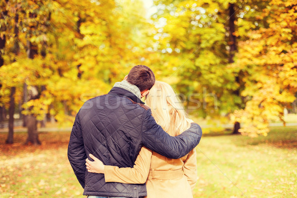 couple hugging in autumn park from back Stock photo © dolgachov