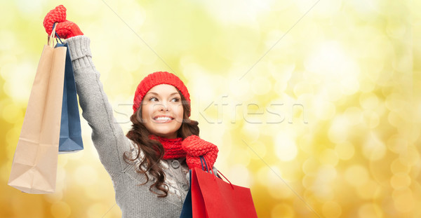 happy woman in winter clothes with shopping bags Stock photo © dolgachov