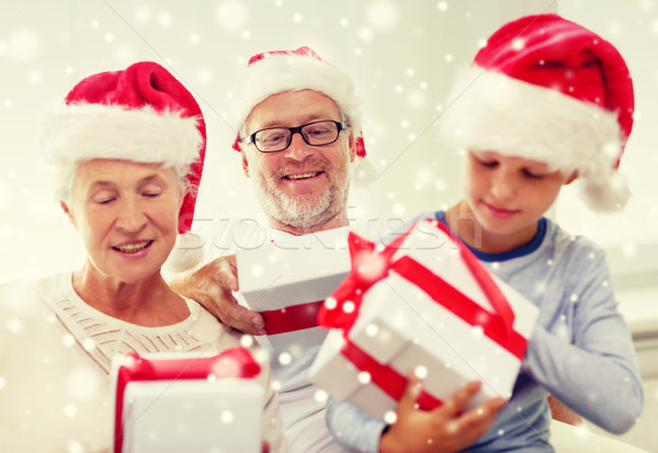 happy family sitting on couch at home Stock photo © dolgachov