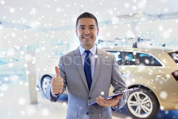 happy man at auto show or car salon Stock photo © dolgachov