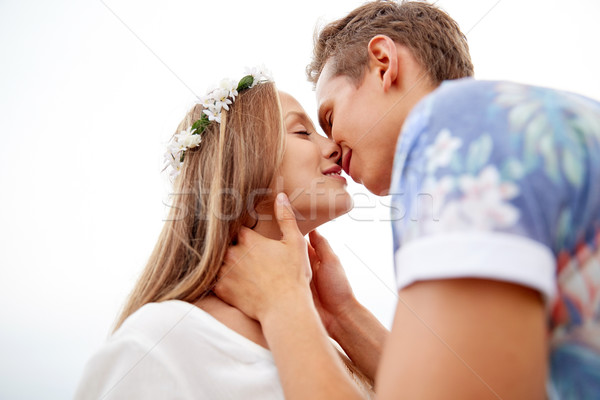 Heureux souriant jeunes hippie couple baiser [[stock_photo]] © dolgachov