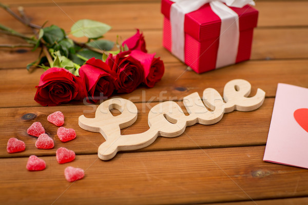 close up of gift box, red roses and greeting card Stock photo © dolgachov