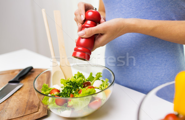 close up of woman cooking vegetable salad at home Stock photo © dolgachov