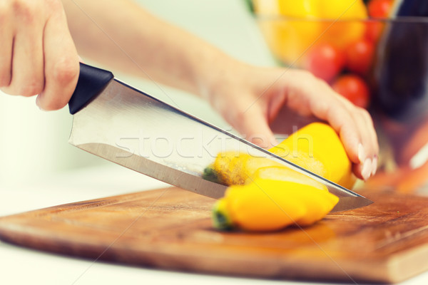 close up of hands chopping squash with knife Stock photo © dolgachov