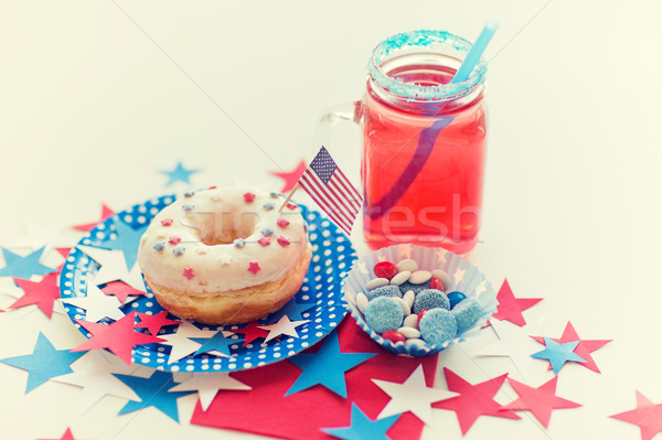 donut with juice and candies on independence day Stock photo © dolgachov