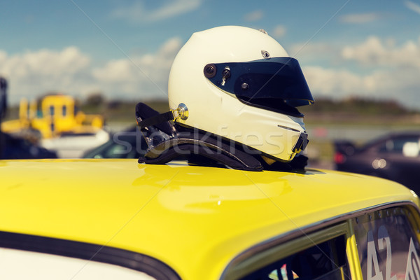 close up of car with helmet on roof top Stock photo © dolgachov