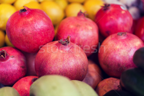 close up of pomegranate at street farmers market Stock photo © dolgachov