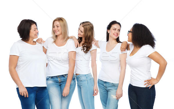 group of happy different women in white t-shirts Stock photo © dolgachov