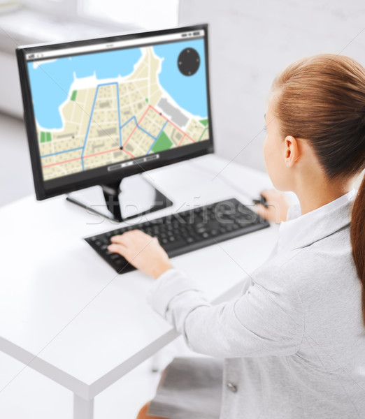 businesswoman with gps navigator map on computer Stock photo © dolgachov