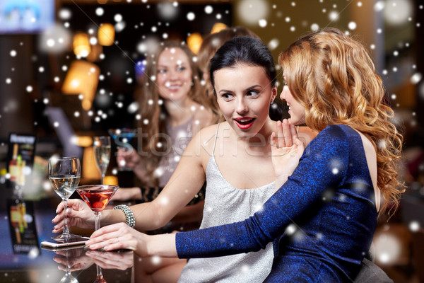 Stock photo: happy women with drinks at night club