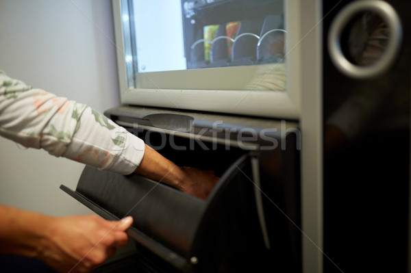 hand taking purchase from vending machine Stock photo © dolgachov