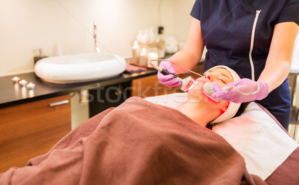 young woman having face microdermabrasion at spa Stock photo © dolgachov