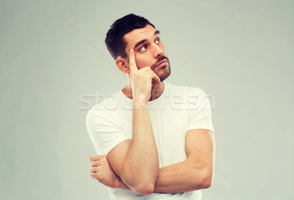 man thinking over gray background Stock photo © dolgachov
