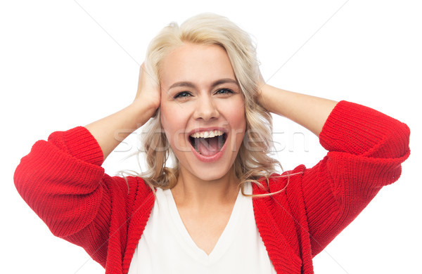 happy young woman holding her head and laughing Stock photo © dolgachov