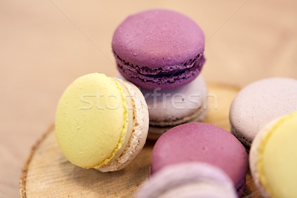 close up of different macarons on wooden stand Stock photo © dolgachov