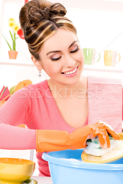 housewife washing dish Stock photo © dolgachov