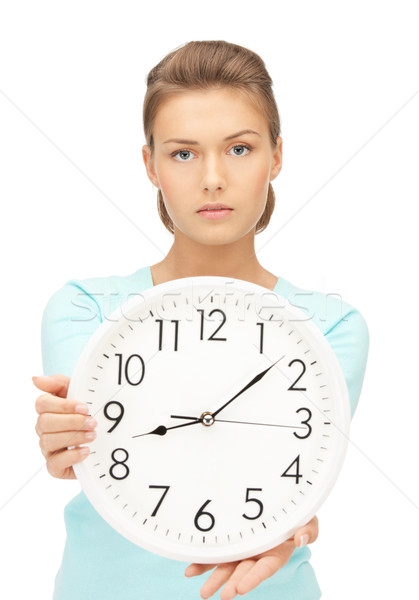 woman holding big clock Stock photo © dolgachov