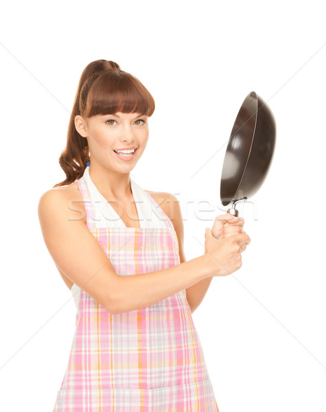 housewife with frying pan Stock photo © dolgachov