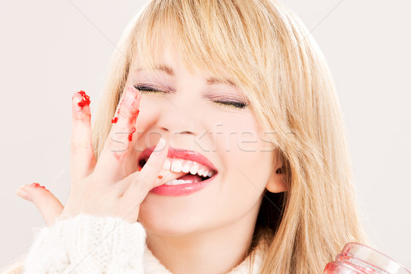 happy teenage girl with raspberry jam Stock photo © dolgachov