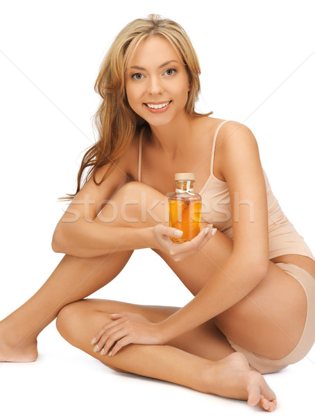 Vrouw katoen olie fles foto lichaam Stockfoto © dolgachov
