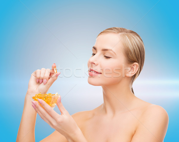 женщину Омега-3 Витамины здравоохранения красоту лице Сток-фото © dolgachov