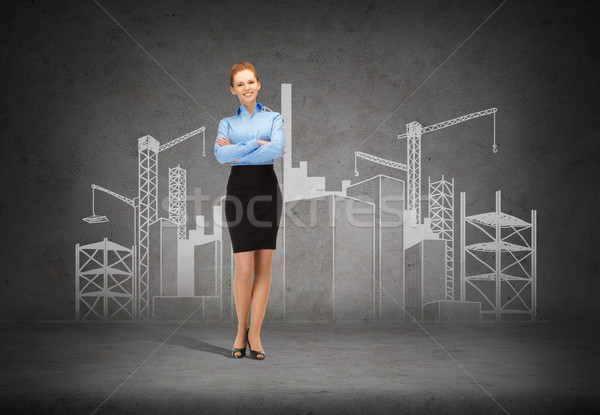 young smiling businesswoman with crossed arms Stock photo © dolgachov