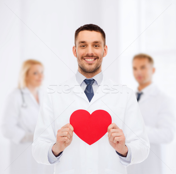 Gülen erkek doktor kırmızı kalp tıp meslek Stok fotoğraf © dolgachov