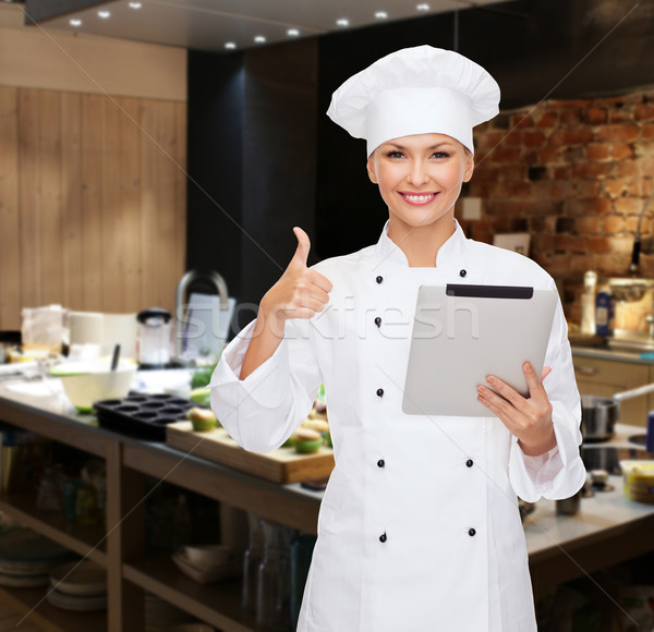 smiling female chef with tablet pc computer Stock photo © dolgachov