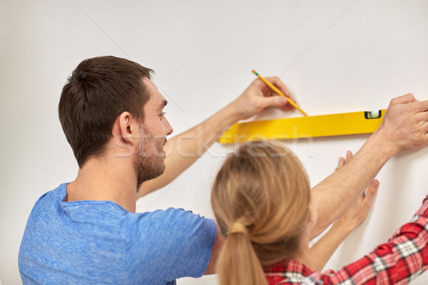 Foto stock: Casal · nível · parede · reparar