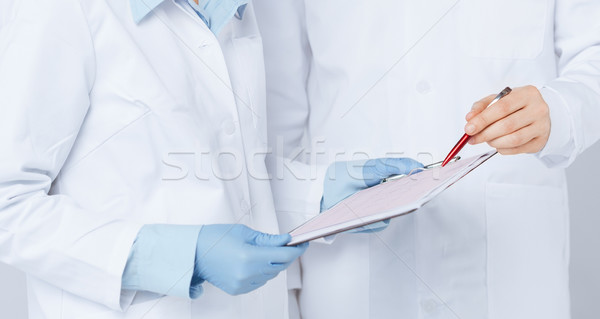Stock photo: nurse and male doctor holding cardiogram